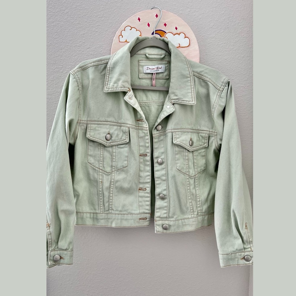 Pastel green denim jacket with a relaxed fit